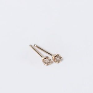 PAIR diamond studs. Gold- 14kt  Each diamond .05